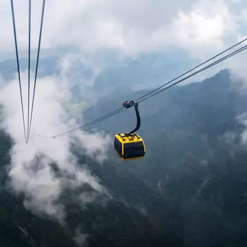 The world's longest electric cable car to Fan Si Pan mountain peak, the highest mountain of Indochina, with mist over the mountains