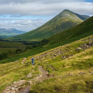 Two people hiking on a rocky trail through grassy hills in the Scottish highlands.
1155064177
background, beautiful, europe, highland, highlands, hiker, hikers, hiking, hill, landscape, mountain, nature, outdoor, path, scenery, scenic, scotland, scottish, tourism, trail, travel, trekking, view, walking, way, west