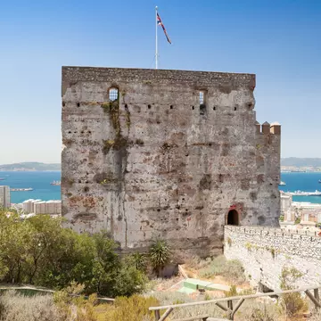 The tower of the Moorish Castle in Gibraltar, with views to the sea in the background.
