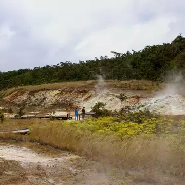 Tourists view the Sulphur banks that can be found walking along the boardwalk in Volcanoes National Park on the Big Island, Hawaii. Volcanic gases steam from the ground as sulphur vents / steam vents
1285860174
steam vents, sulphur vents, volcanoe...