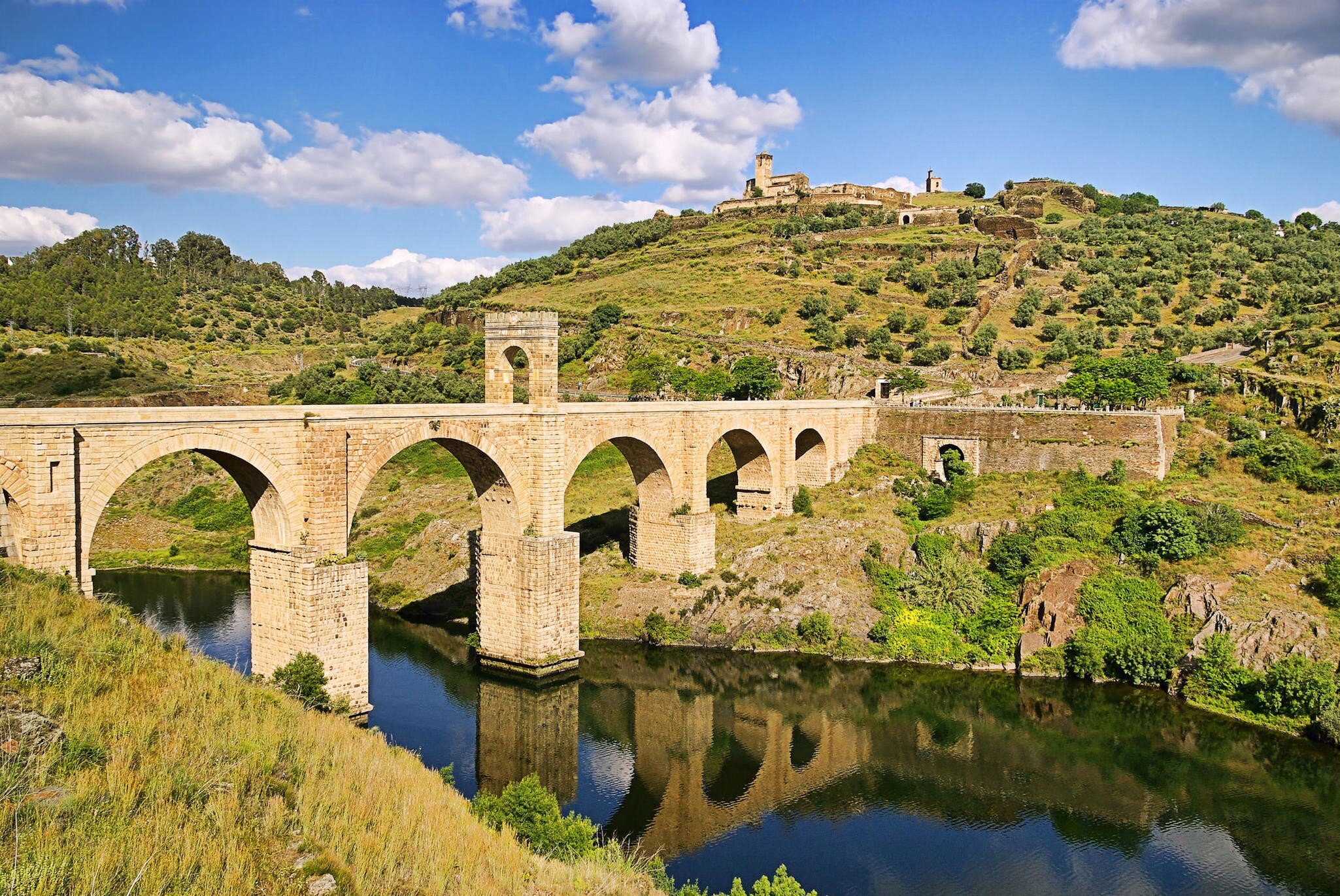 View of the Roman bridge crossing the Río Tajo in Alcántara, Spain.