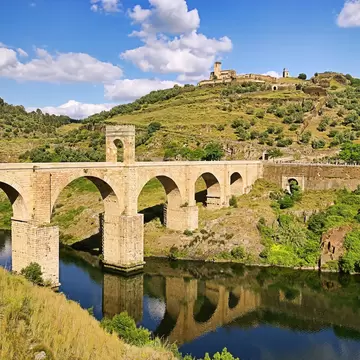 View of the Roman bridge crossing the Río Tajo in Alcántara, Spain.