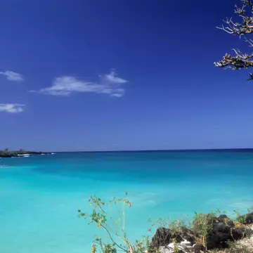 A man stanging on the edge of Le Galawa Beach, Grande Comore, Comoros, Africa