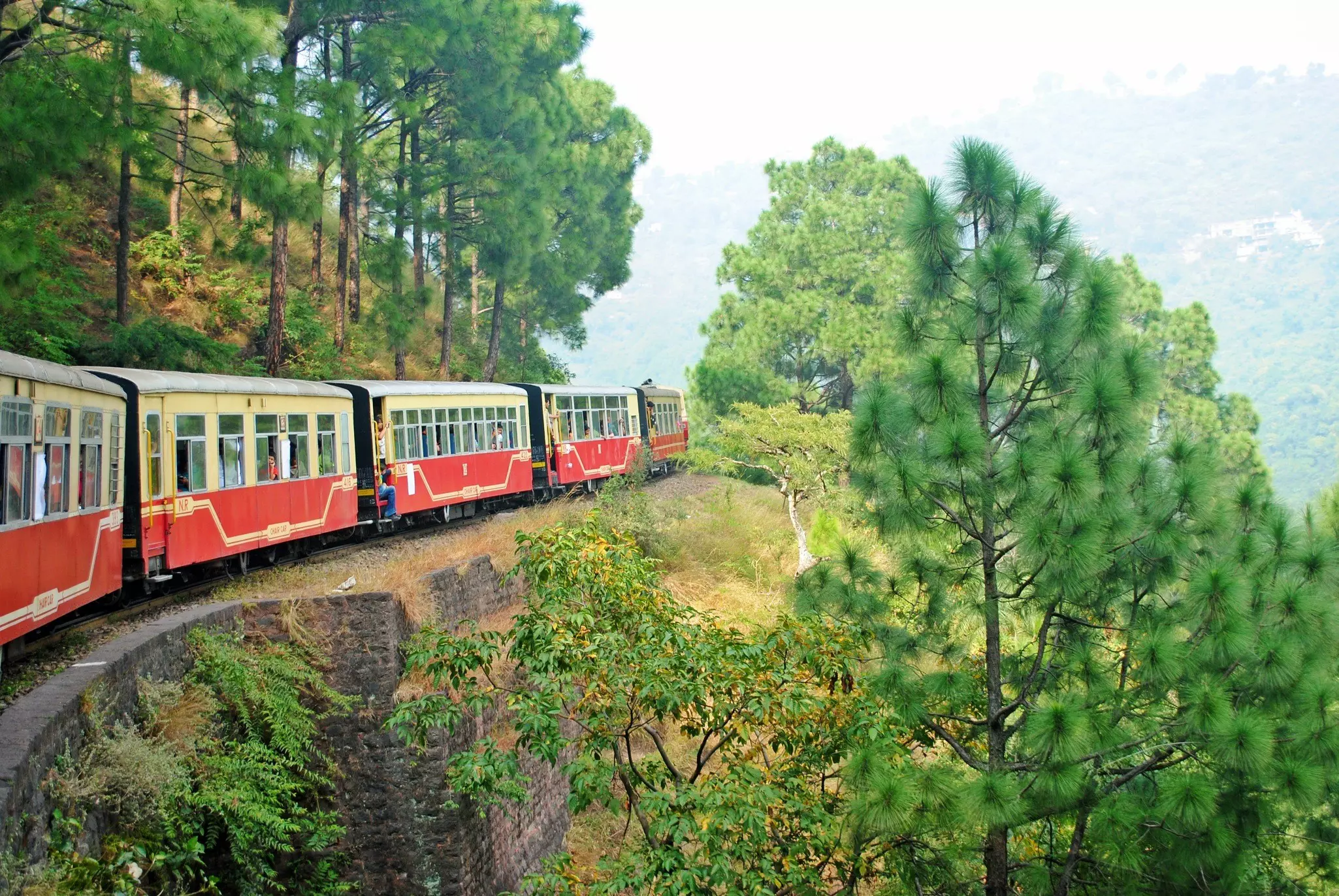 Toy train in the mountains on the Kalka–Shimla route, India.