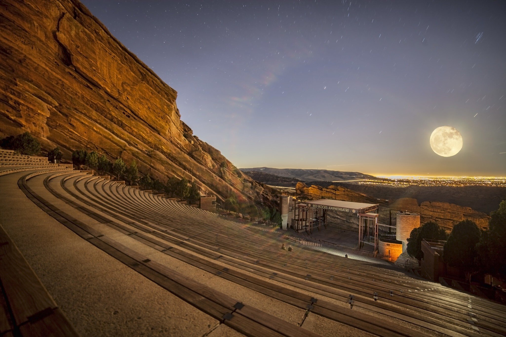 A full moon rising over Red Rocks Amphitheatre near Denver, Colorado