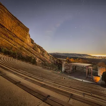 A full moon rising over Red Rocks Amphitheatre near Denver, Colorado