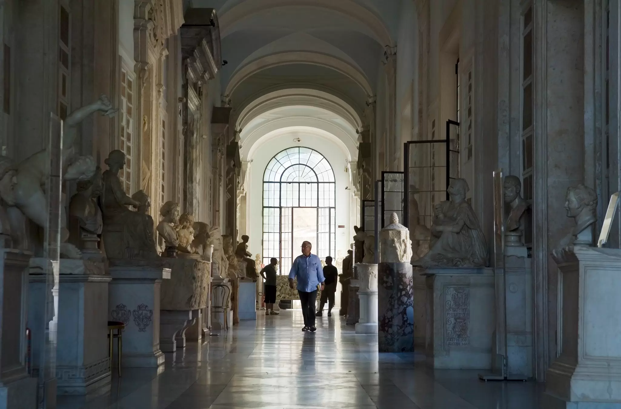 A man walks through the Hall of Philosophers at the Capitoline Museum in Rome. 