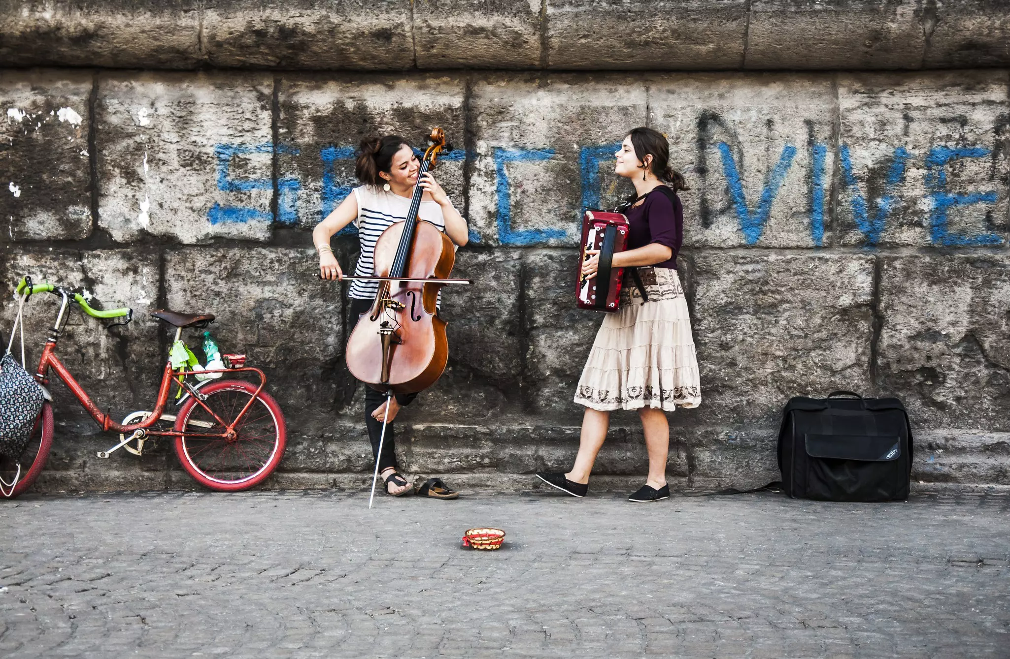NAPLES - JUNE 17: two young musicians play music on the street in Naples, Italy.