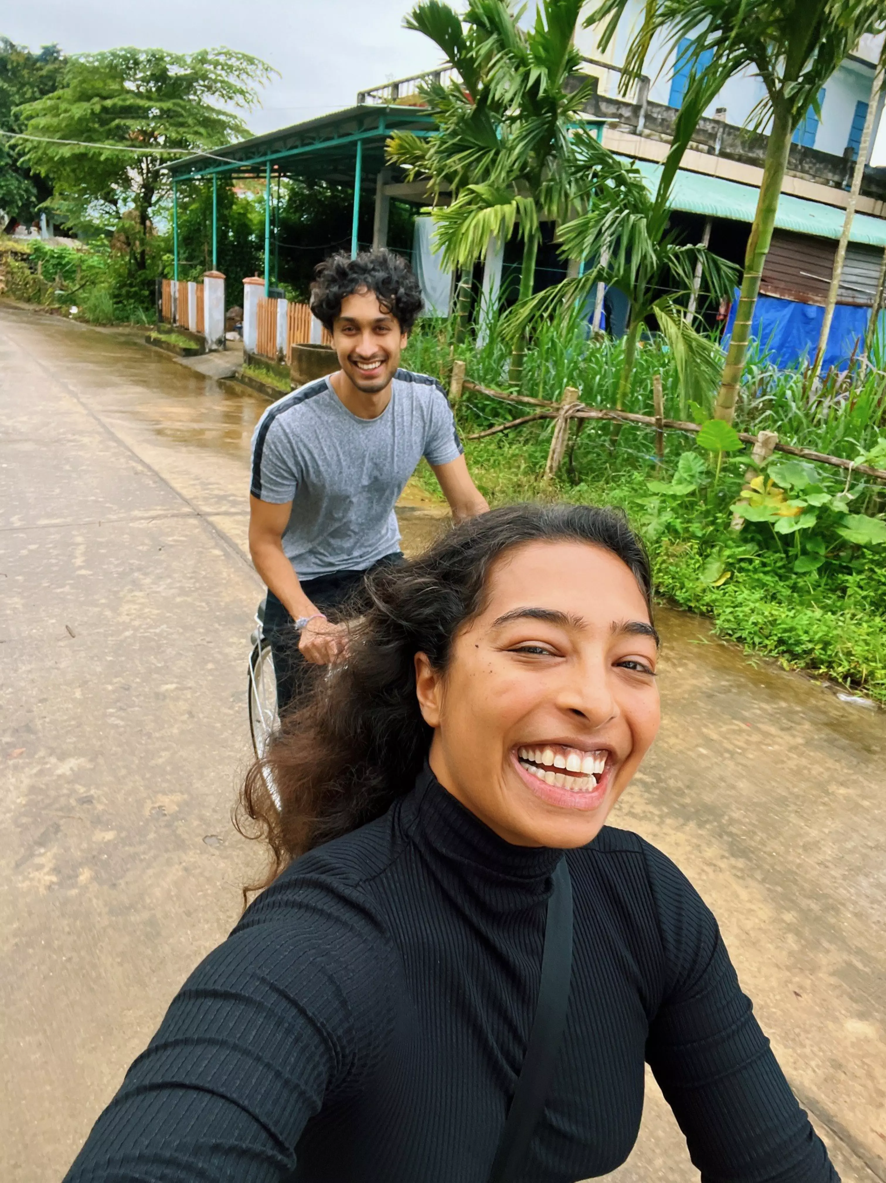 Sana Javeri and her brother riding bicycles through the rice fields in Cẩm Kim, Vietnam