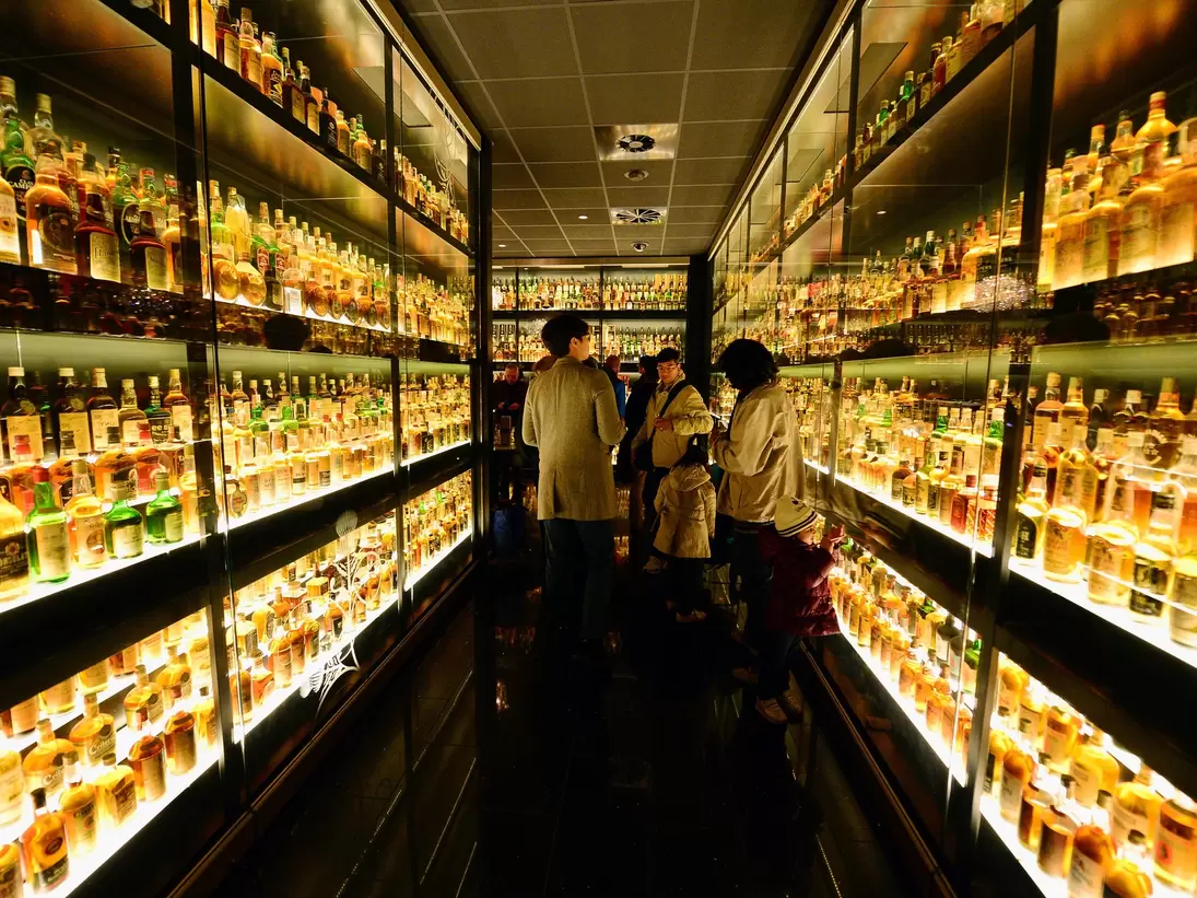 EDINBURGH, SCOTLAND - MARCH 19:  Members of the public view the Diageo Claive Vidiz Collection, the world's largest collection of Scottish Whisky on display at The Scotch Whisky Experience on March 19, 2014 in Edinburgh, Scotland. Chancellor of th...