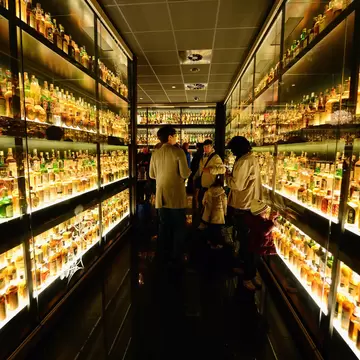 EDINBURGH, SCOTLAND - MARCH 19:  Members of the public view the Diageo Claive Vidiz Collection, the world's largest collection of Scottish Whisky on display at The Scotch Whisky Experience on March 19, 2014 in Edinburgh, Scotland. Chancellor of th...