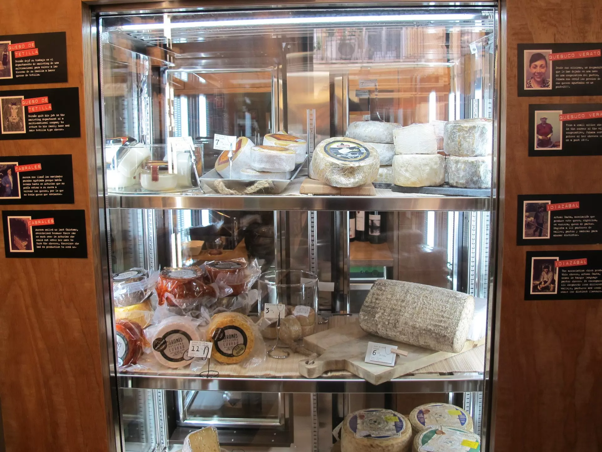 Cheese display with photos of producers