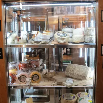 Cheese display with photos of producers