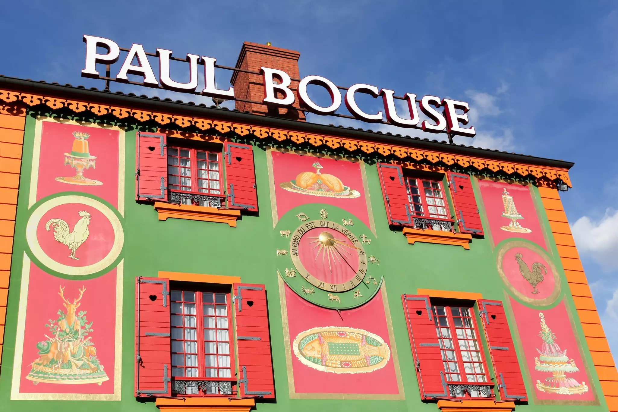 Chef Paul Bocuse outside his flagship restaurant, l'Auberge du Pont de Collonges.