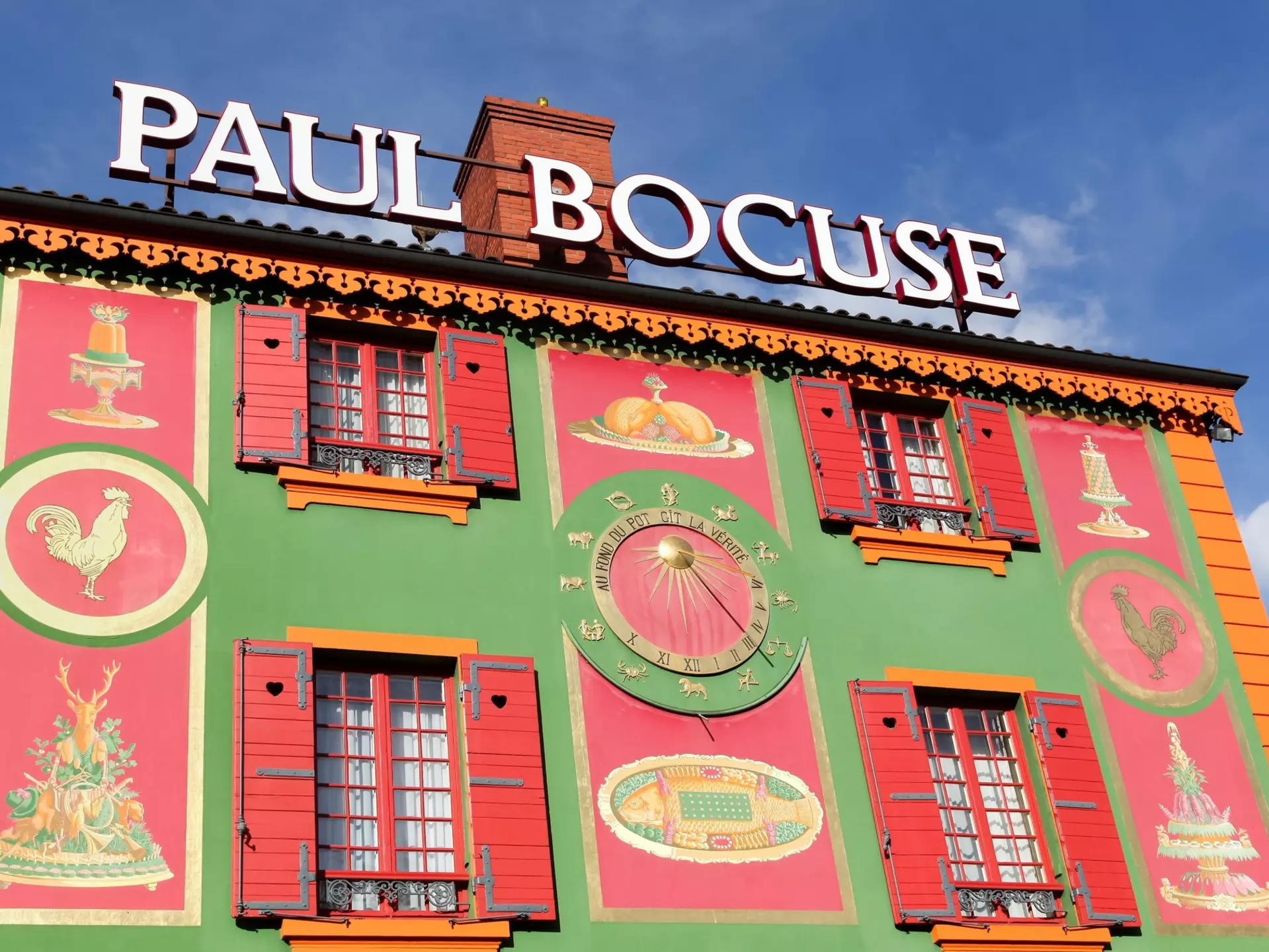 Chef Paul Bocuse outside his flagship restaurant, l'Auberge du Pont de Collonges.