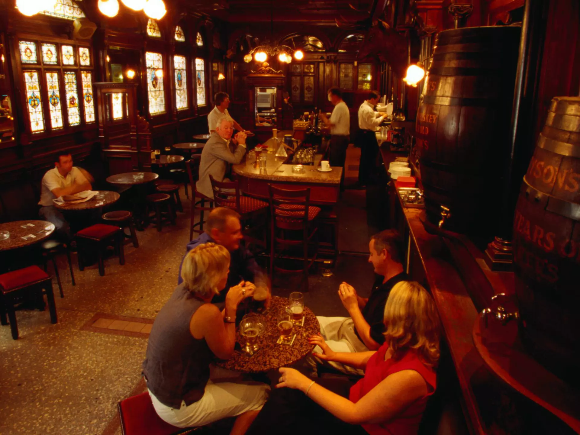 Drinkers in the atmospheric interior of the Stag's Head pub in Dublin, Ireland. Oliver Strewe/Getty Images