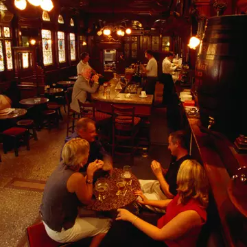 Drinkers in the atmospheric interior of the Stag's Head pub in Dublin, Ireland. Oliver Strewe/Getty Images