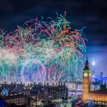 Colorful fireworks in the night sky with Big Ben clocktower in the skyline
