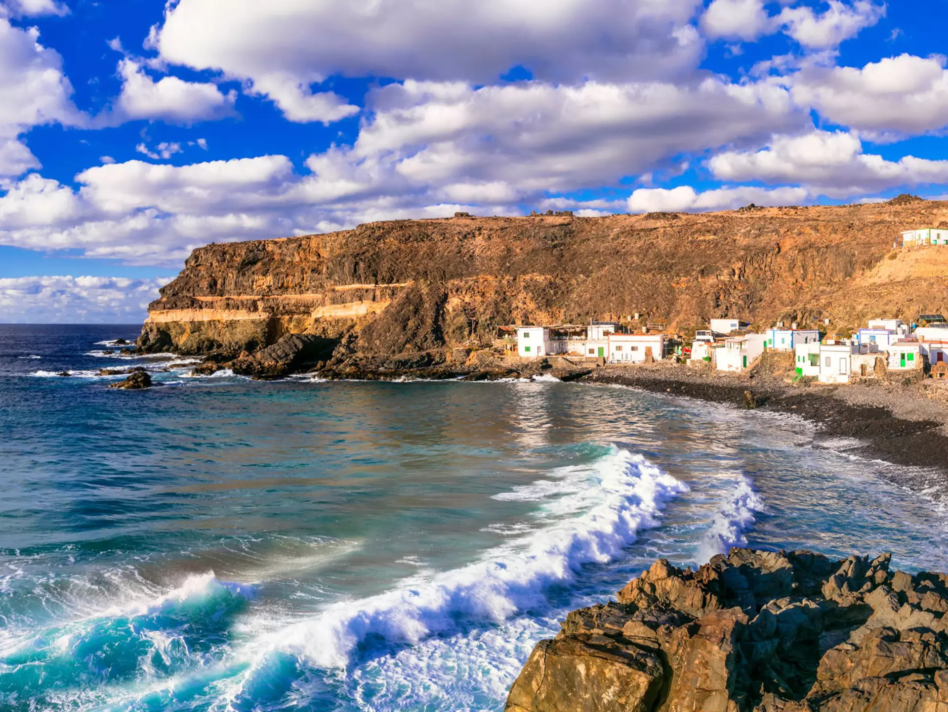 Waves rolling onto the beach near the fishing village of Puertito de Molinos, Fuerteventura