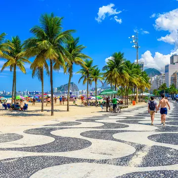 View of Copacabana beach and Leme beach with palms and mosaic of sidewalk in Rio de Janeiro, Brazil. Copacabana beach is the most famous beach of Rio de Janeiro, Brazil. cityscape of Rio de Janeiro  License Type: media  Download Time: 2023-05-20T12:19:09.000Z  User: claramonitto  Is Editorial: No  purchase_order:   
