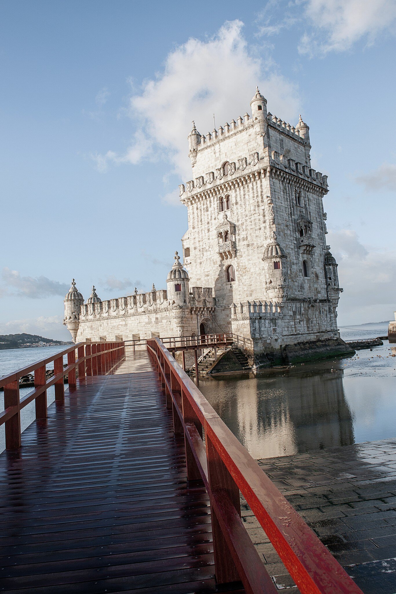Bridge over water leading toward the Torre de Belém in Lisbon, Portugal.