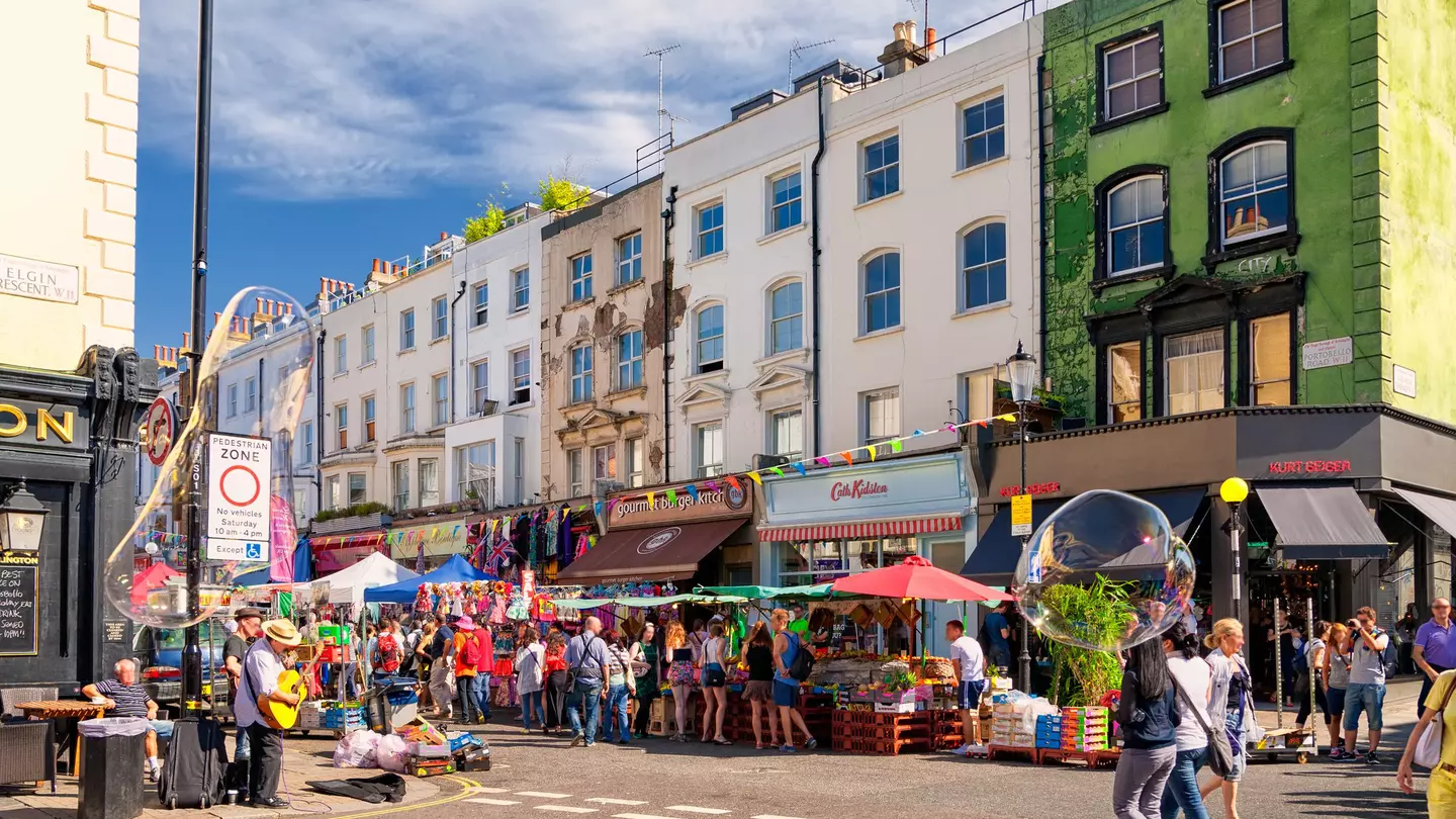 People walking in the street in Notting Hill's Portobello Road Market