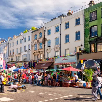 People walking in the street in Notting Hill's Portobello Road Market