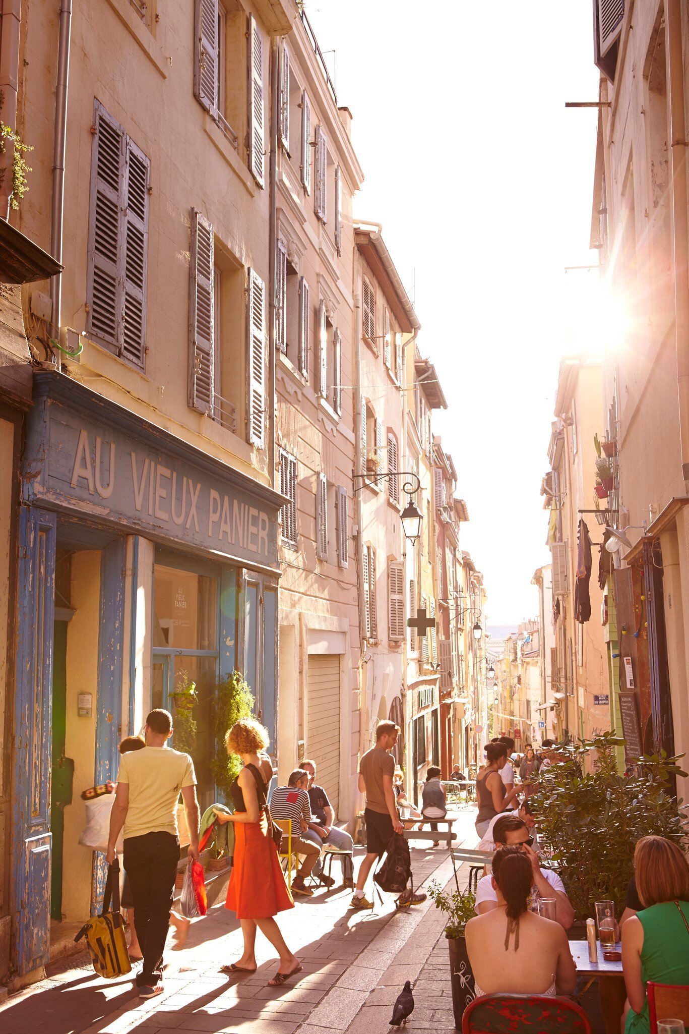 Laneway lined with shops and cafes in Marseille’s Le Panier district, France.