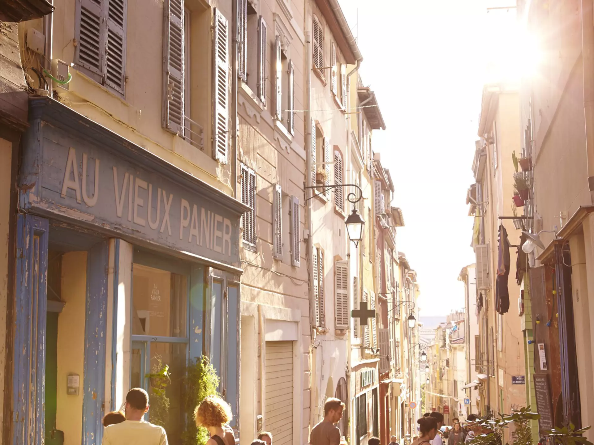 Laneway lined with shops and cafes in Le Panier district, Marseille