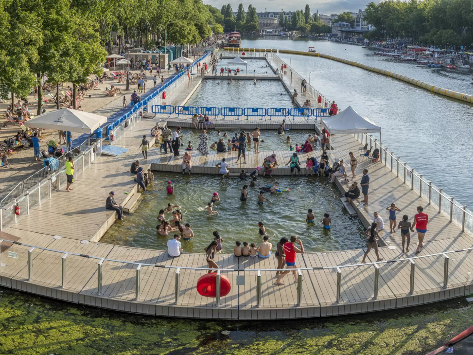 Paris Beach, Bassin de la Villette. View the oudoor pool and the instalations along the quays during Paris Beach in summer