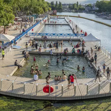 Paris Beach, Bassin de la Villette. View the oudoor pool and the instalations along the quays during Paris Beach in summer