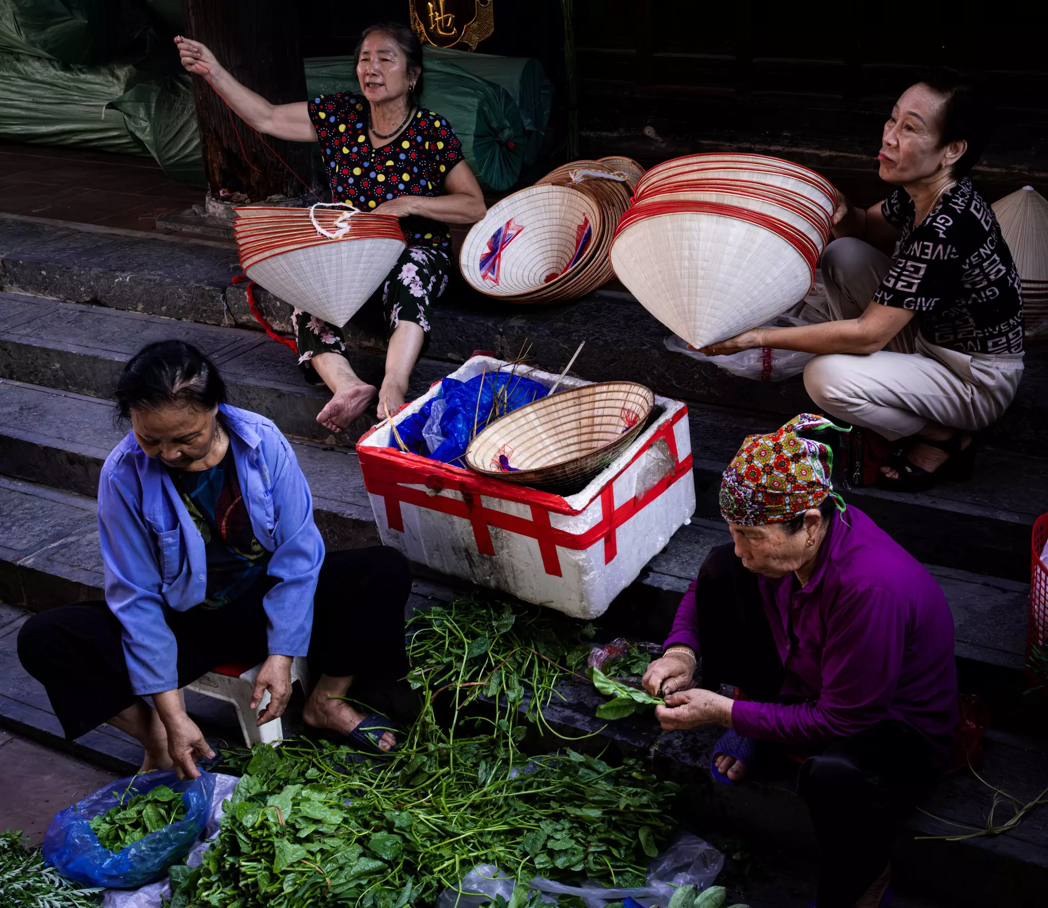 Traders at a hat market near Hanoi