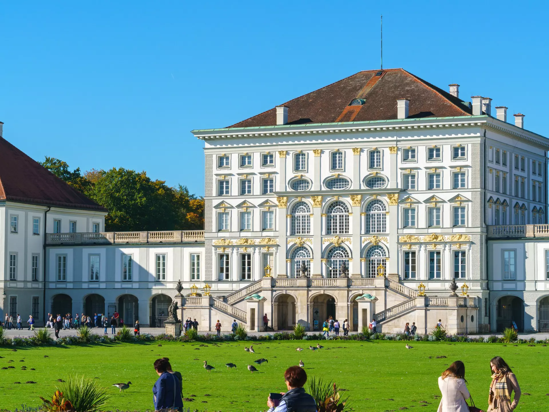 Visitors on the lawn in front of the Nymphenburg Palace, Munich