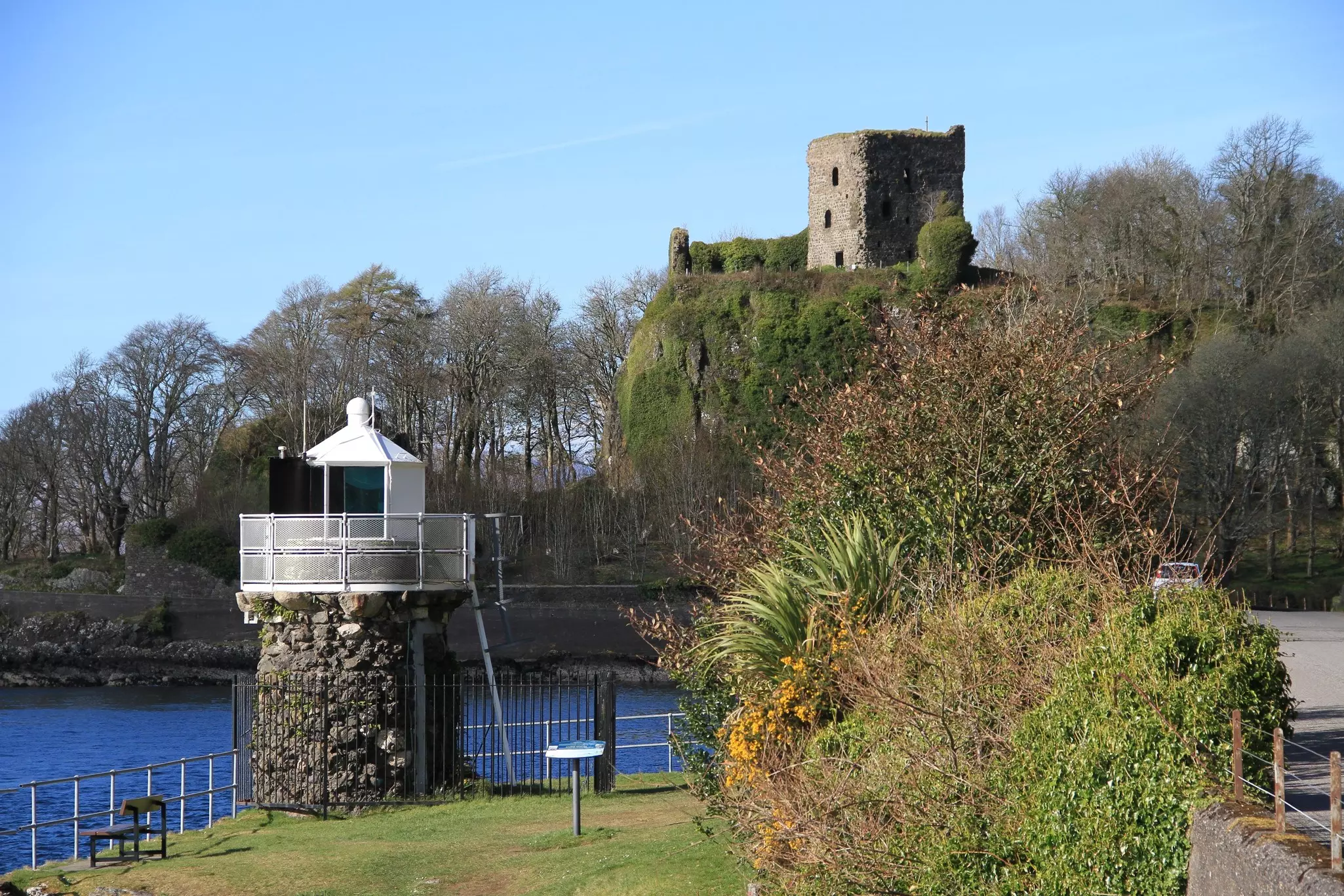A view to the Dunollie Lighthouse and Dunollie Castle, near Oban, Scotland.