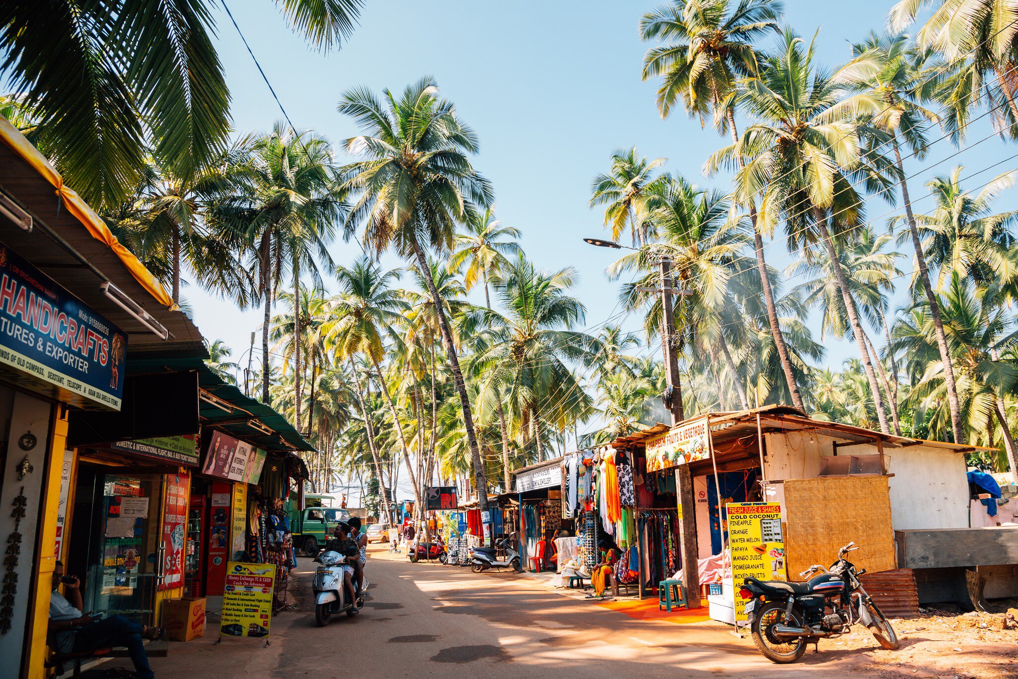 Old market street with palm trees at Palolem beach, Goa, India.