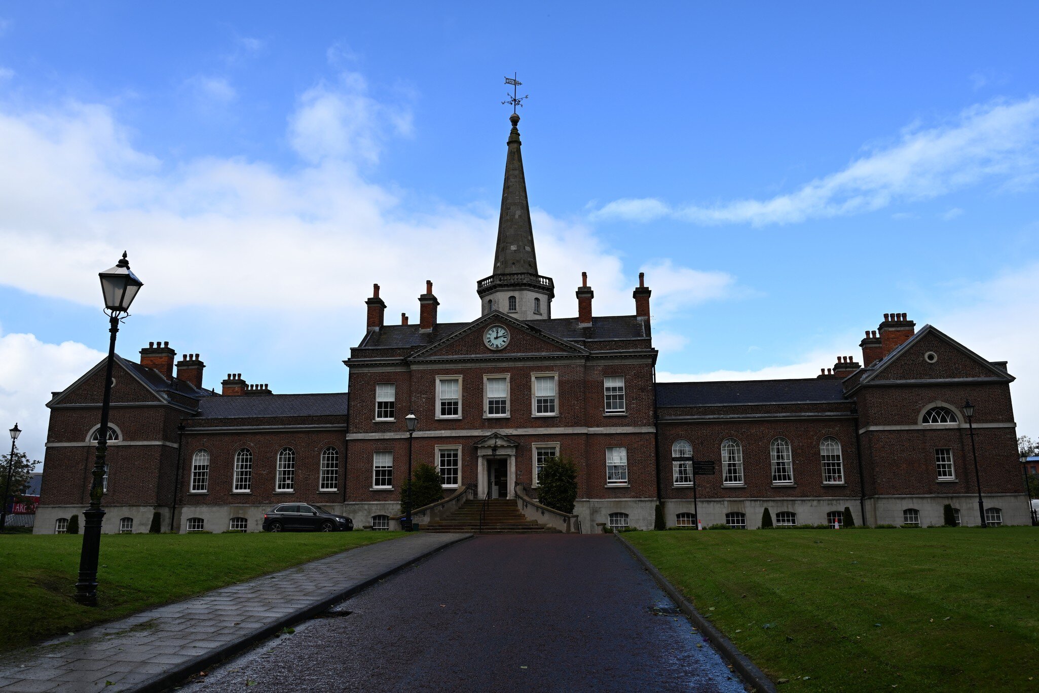 Cliften House exterior in Northern Ireland, Belfast. Clock tower with blue sky in background.