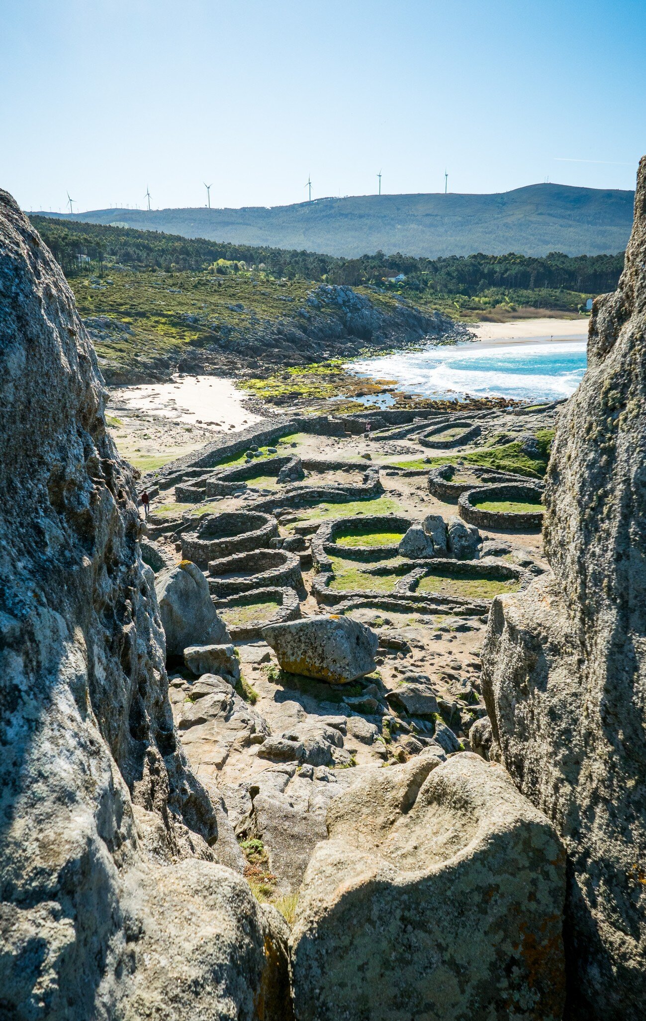 View of the ruins of the prehistoric settlement of Castro de Baroña in the Rías Baixas, Spain.