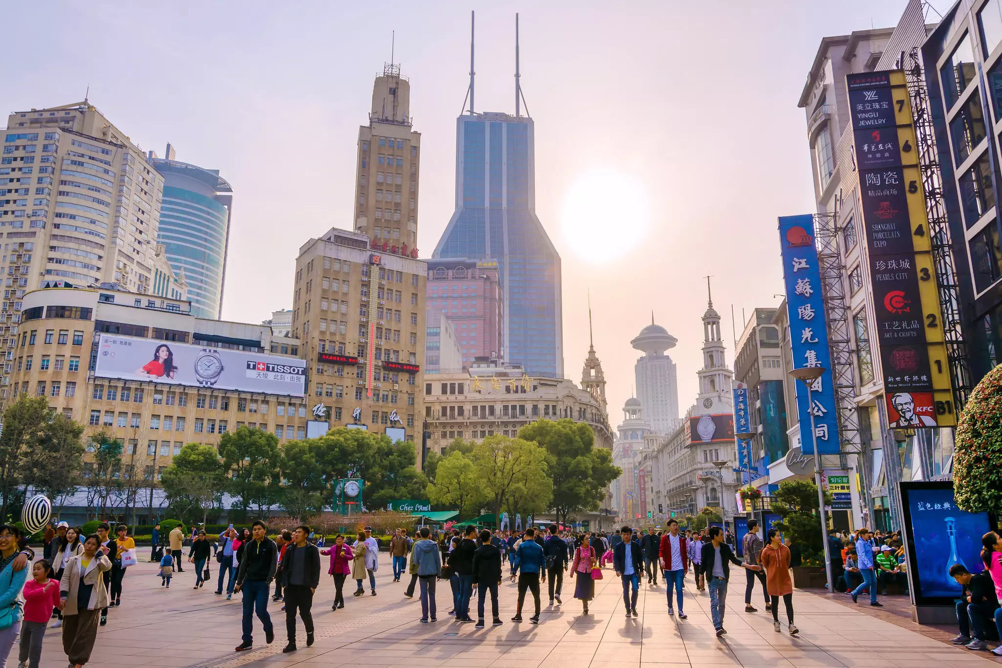 People walking along East Nanjing Rd in Shanghai, China, late in the afternoon.