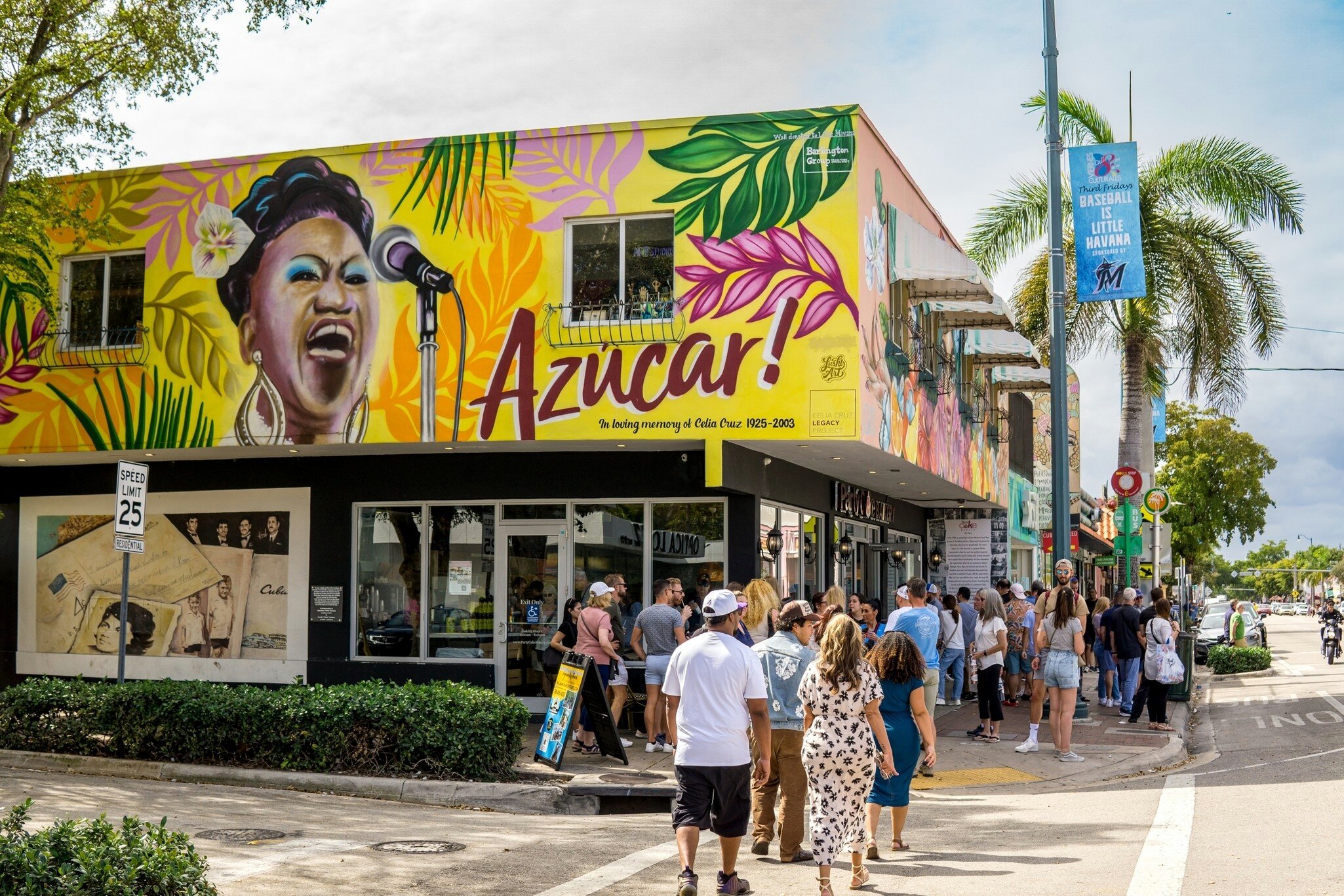 Miami, United States - March 21, 2016: Tourists stand to order from the open air countertop of a restaurant advertising Cuban food and drinks on historic Calle Ocho in Little Havana.