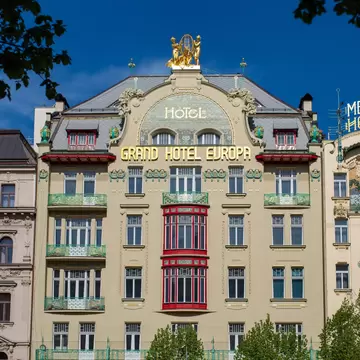 Beautiful historical building of Grand Hotel Evropa and Meran Hotel in Prague city centre on a sunny spring day. Prague, Czech Republic. 
