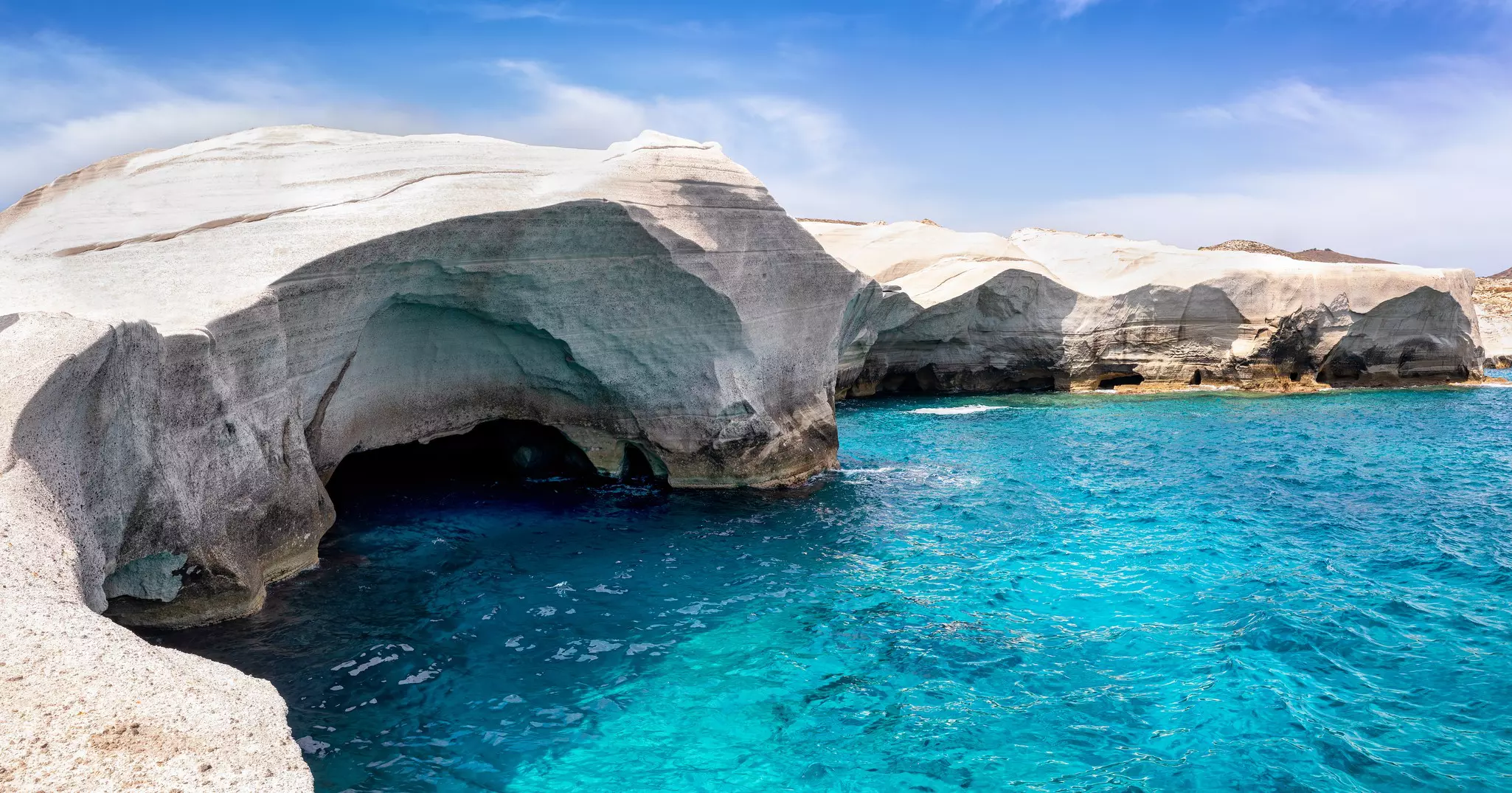 Unusual rock formations over blue waters