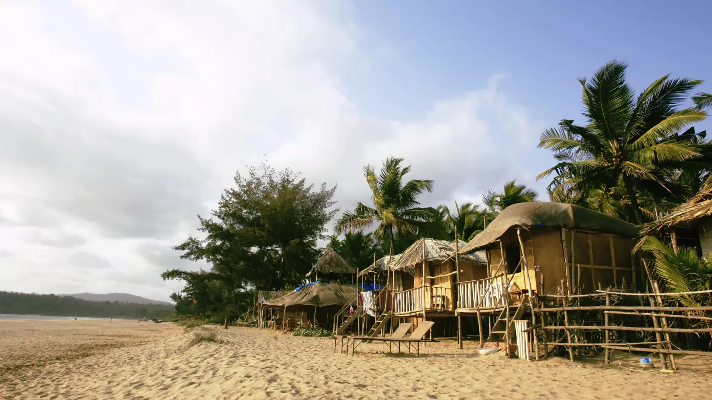 Beach huts on Agonda Beach on a sunny day