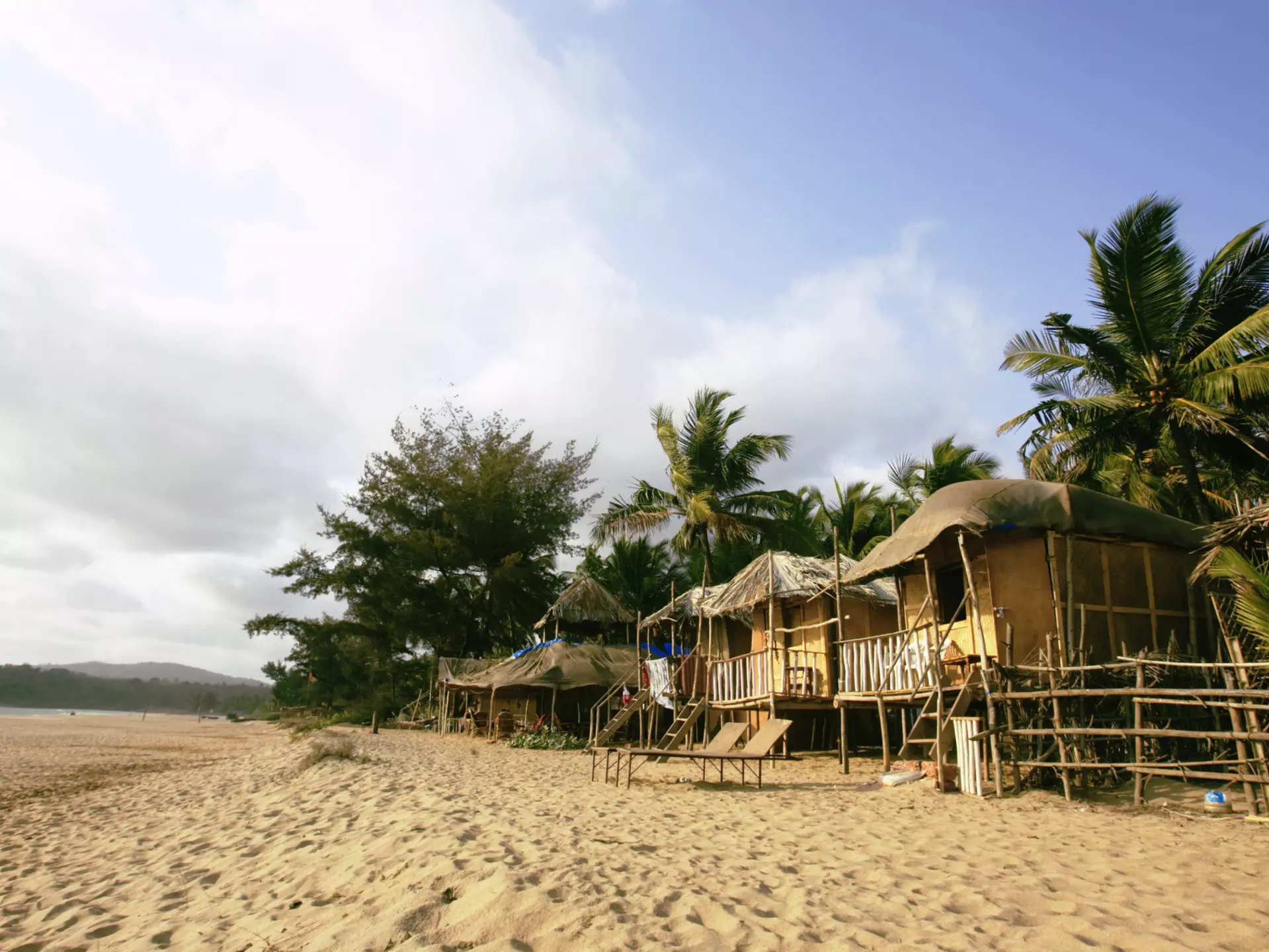 Beach huts on Agonda Beach on a sunny day