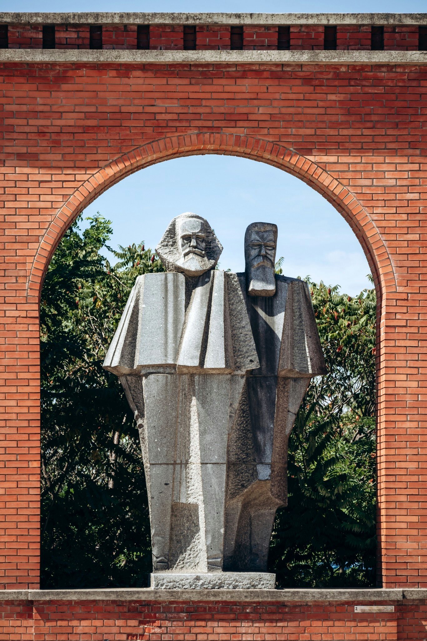 Statues of Karl Marx and Friedrich Engels in Memento Park in Budapest, Hungary.
