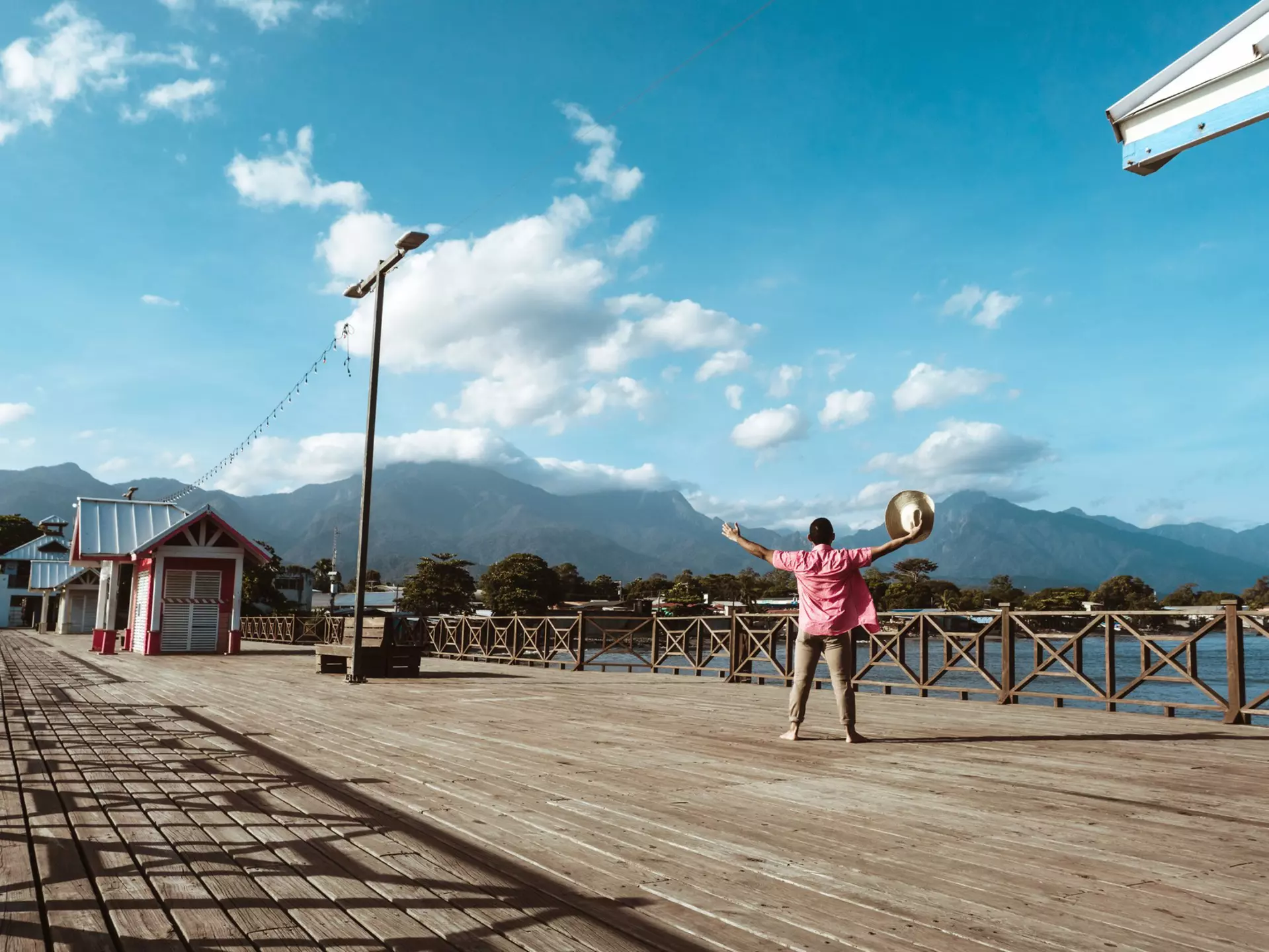 Tourist in a hat in the port of the city of La Ceiba, Honduras
