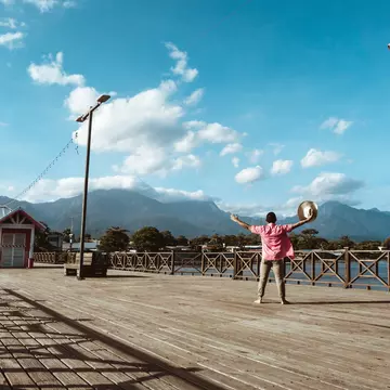 Tourist in a hat in the port of the city of La Ceiba, Honduras