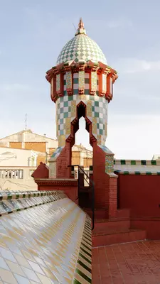 A blue-and-white tiled cupola with a red archway.
