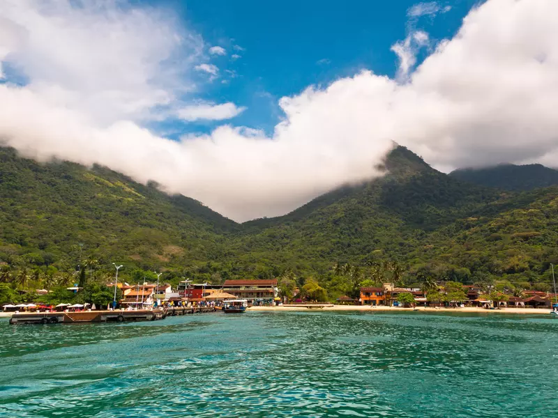 Vila do Abraao town view from the sea with beautiful landscape. Located in Ilha Grande island near Rio de Janeiro, it is a perfect getaway from busy city life.