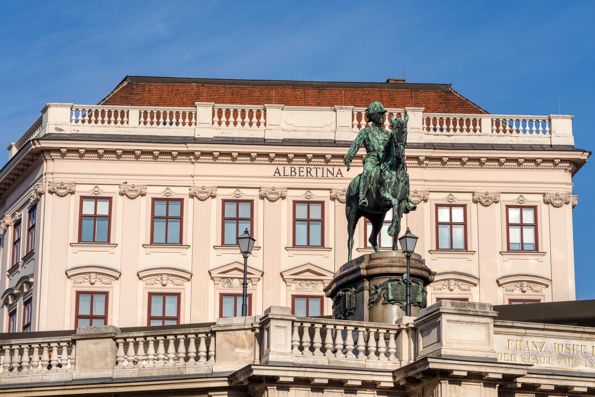 Austria, Vienna, Albrechtsplatz: Front view of world famous Albertina museum palais palace with Albrecht statue in the city center of the Austrian capital with blue sky - concept travel history art; Shutterstock ID 1338388385;
