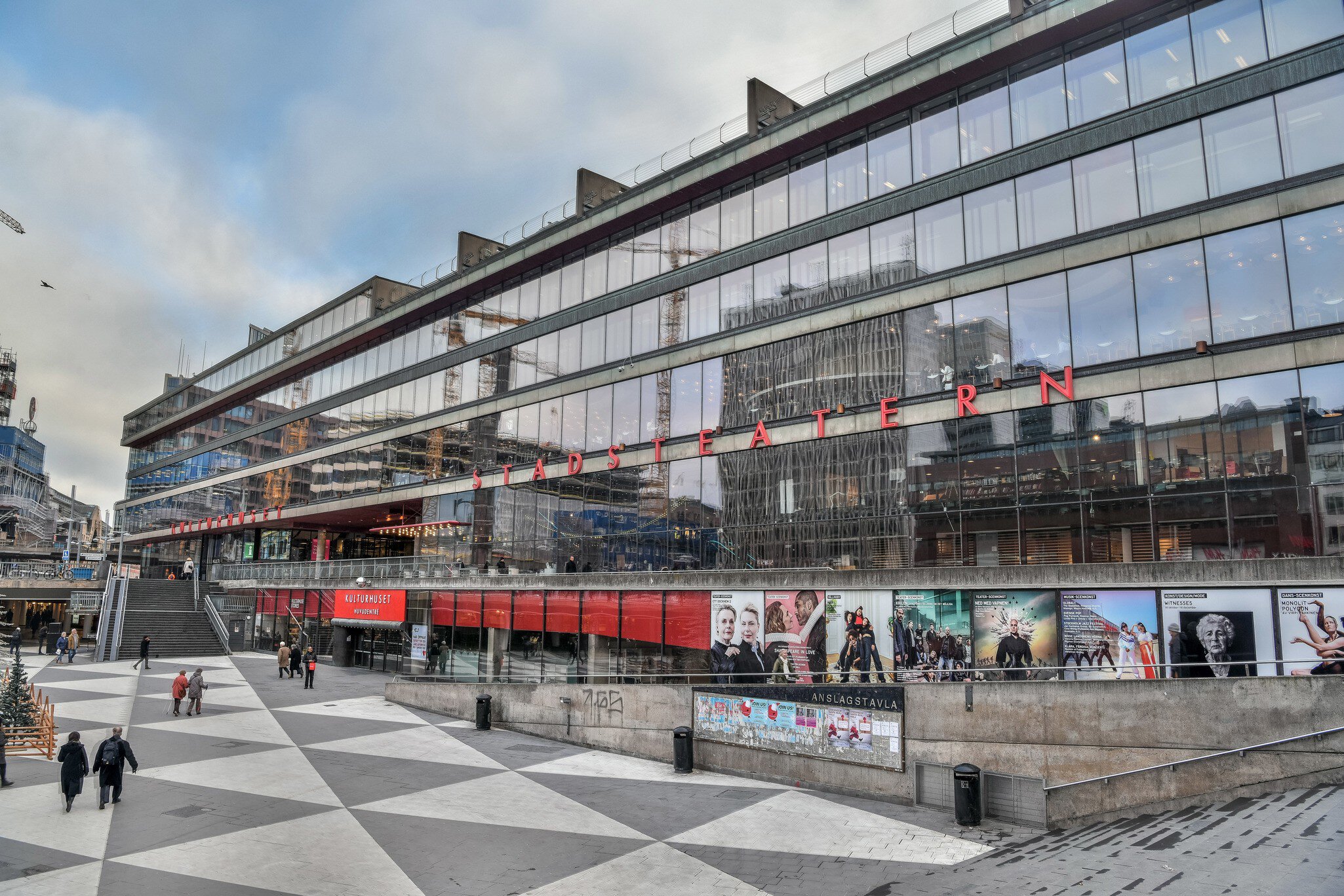Stockholm, Sweden - November 22, 2018.  Exterior view of the House of Culture (Kulturhuset) in Stockholm, with billboards and people.